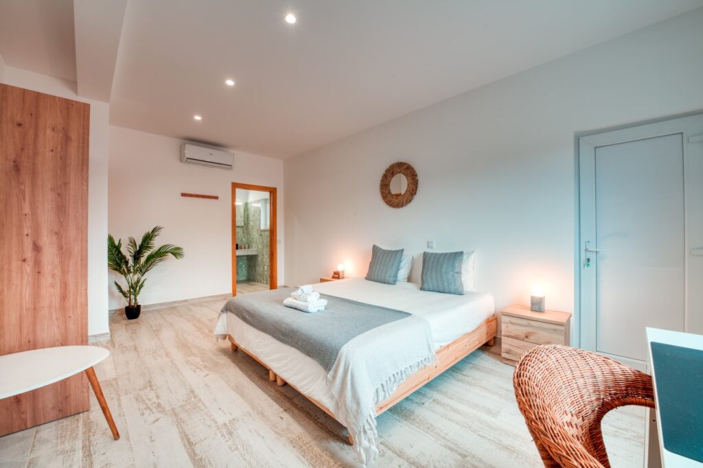 View of Lyon bedroom showing a bed and the bathroom door