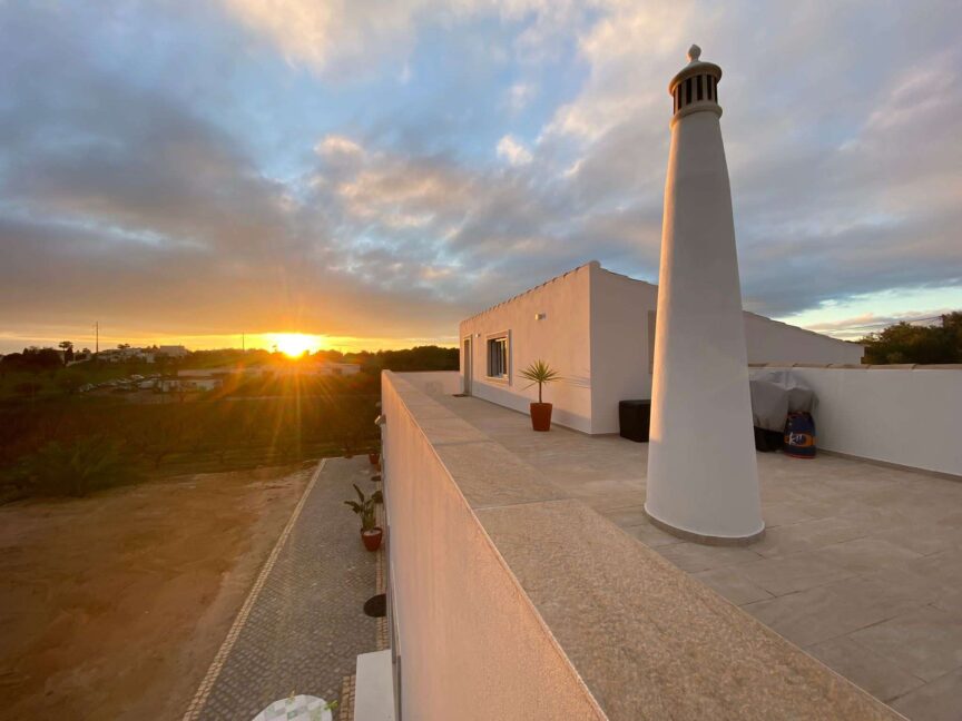 View of POMAR coliving rooftop during sunset