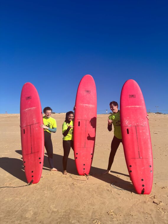 Portrait of colivers surfing on Praia do Barril in Faro, Portugal