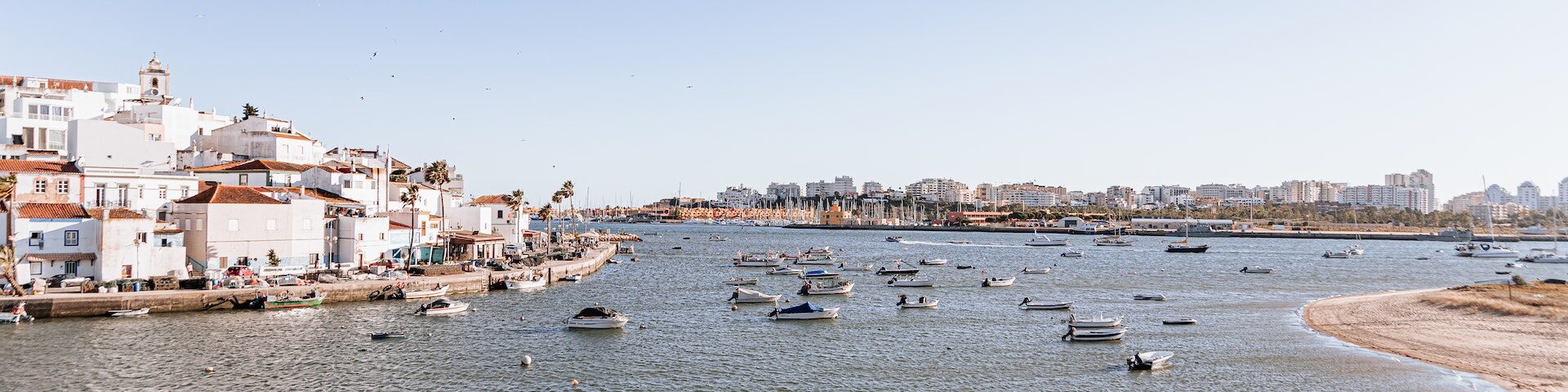 Exploring the Hidden Gems of Olhao Top Activities to Add to Your Travel Itinerary – POMAR Coliving Algarvian city with boats on the ria formosa