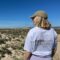 coliver Amanda at Armona Island representing POMAR Coliving, Algarve Amanda, coliver at POMAR Coliving, smiling in her POMAR T-shirt on the beach at Armona Island, Algarve, Portugal