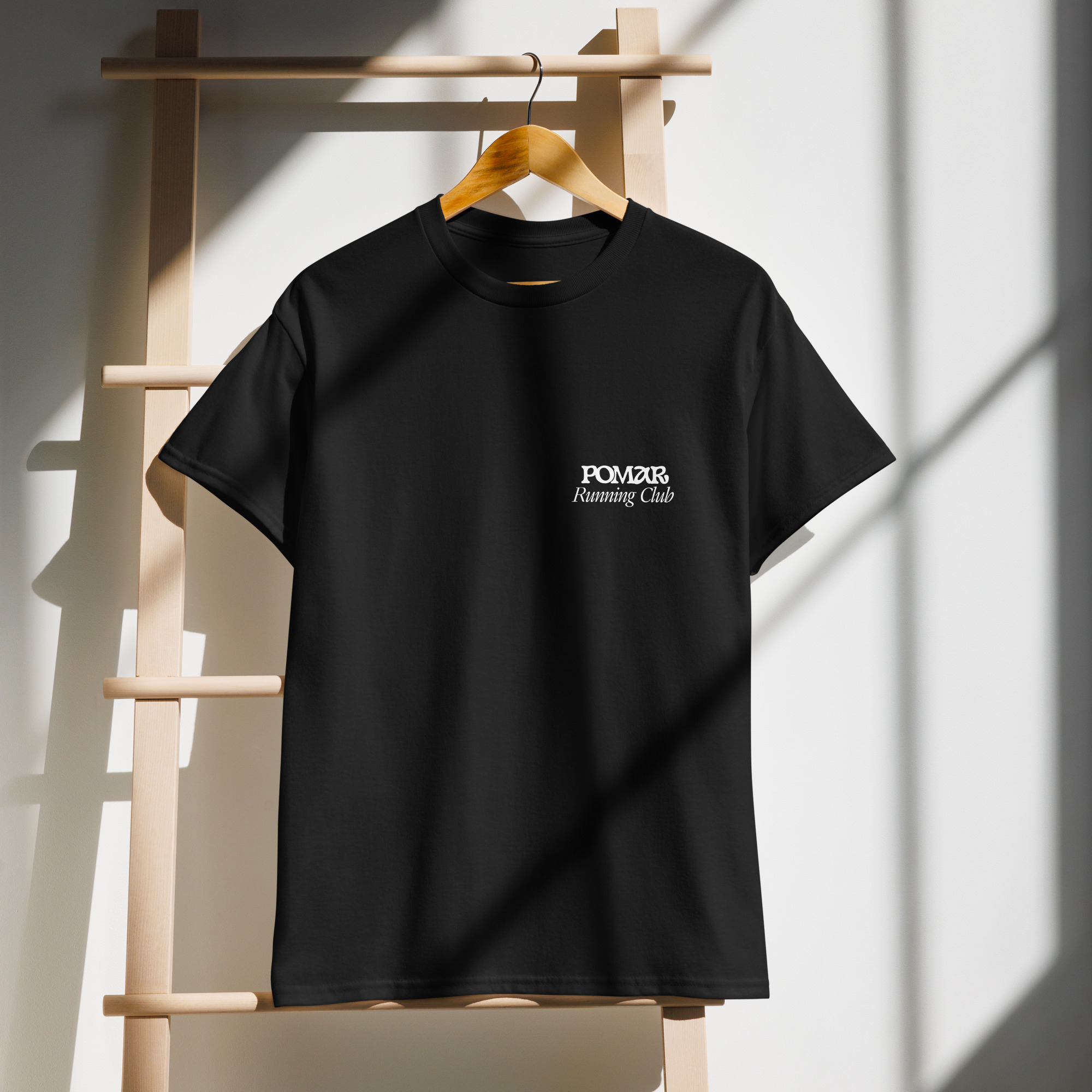 close-up view of the POMAR Running Club T-shirt, highlighting the community spirit of coliving in Algarve, Portugal