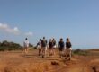 A group of coliver hiking on a trail near the beaches of POMAR coliving in Portugal.