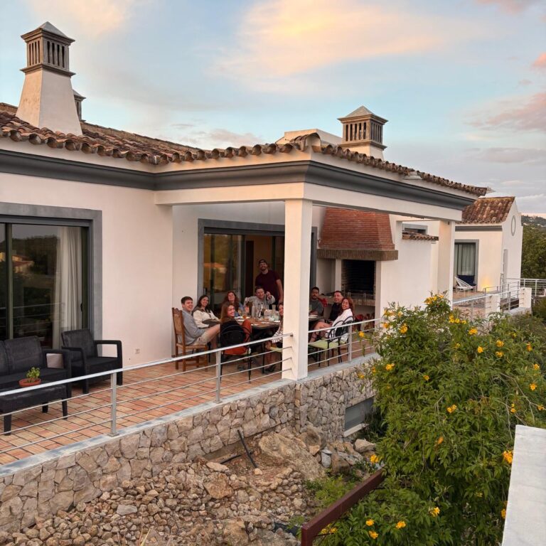 Colivers gathered for a shared dinner on the terrace at POMAR Coliving in the Algarve