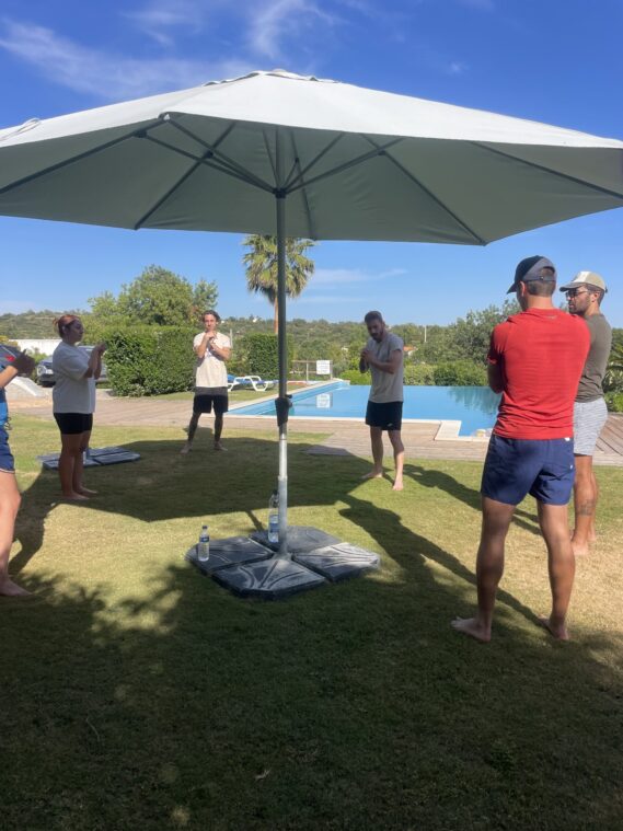 Outdoor MMA class by the pool at POMAR